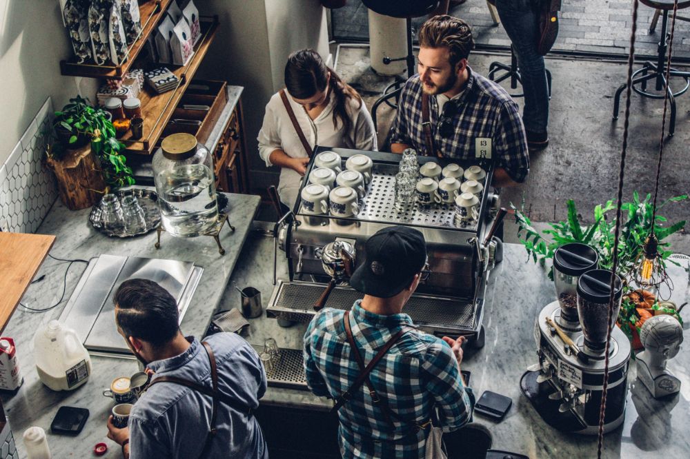 Couple ordering coffee at counter.